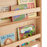 Front view of wall-mounted children’s book rack – compact wooden storage
