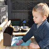 Our mud kitchen can be used from 18 months and up and also includes a blackboard for messages and mud recipes