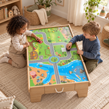 Children’s play table with printed road map for imaginative toy car adventures.