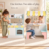 Double-sided wooden play kitchen and café shown from both sides - twice the fun