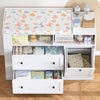 White changing unit with drawers, shelves and removable laundry bag