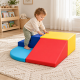 Toddler using the blue foam steps with the turquoise curved mat below