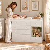 White nursery unit with six drawers and one open shelf beneath a raised-edge top
