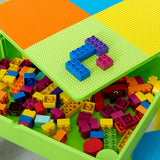 Reversible tabletop, with one side smooth and the other a construction tabletop. 