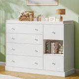 Open drawer showing the interior storage space of a white nursery chest