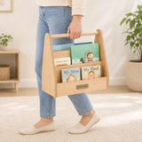 Child choosing book from compact Montessori bookshelf