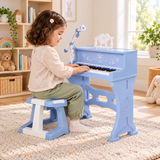 Three-year-old playing the blue electronic piano in the Little Helper brand playroom.