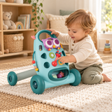 Toddler boy exploring sensory activity panel on blue baby push walker