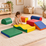 Yellow wave block, green quarter cylinder and blue roller from the toddler soft play set