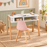 White study desk paired with a pink Scandinavian chair