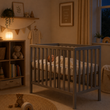 Space saving grey baby cot with slatted wooden sides
