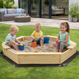 large wooden sandpit with seats in garden