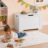 white wooden toy box in playroom with child
