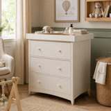 an ivory changing unit with removable top 
