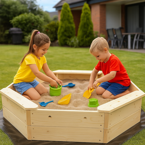Large octagonal sandpit in a garden with children playing