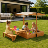 Wooden sandpit picnic table with canopy in garden
