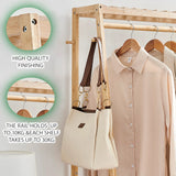 Wooden clothing rack with a beige shirt and handbag, highlighting high-quality finishing showing weight capacity.