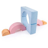Cushioned soft play climbing shapes for an indoor playroom in pastel colours