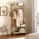 Bamboo Wooden clothing rack with clothes in a room setting