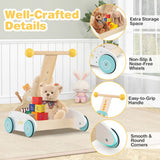 Baby push walker showing rear toy storage and sturdy wooden construction