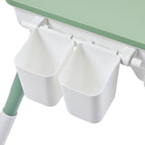 White and green children’s activity table with storage pots