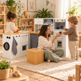 little boy serving mummy a pretend cup of coffee using the pretend coffee maker on this deluxe toy kitchen