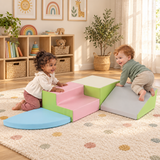 Child exploring the foam ramp during supervised indoor play