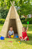 Montessori wooden teepee with boy and girl playing outside