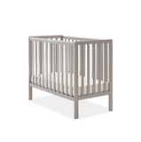 Small nursery cot with sturdy wooden frame in grey