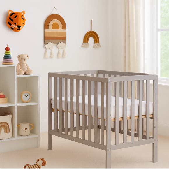 Compact grey wooden baby cot 104 x 85 cm for small nurseries