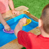 This picnic table and sandpit has a removable splash tub for easy cleaning and a lid to convert into a table