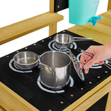 Stainless stell pots and pans and a whisk is included in the set as well as a blackboard for the day's creations