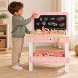 Kids’ pink wooden tool bench with toy saw, ruler, screws and nuts