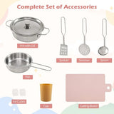 toy kitchen accessories laid out — pots, spatulas, cutting board