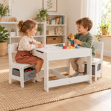 Two children colouring and building wooden blocks at a white kids activity table with grey chair storage bins