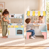 Double-sided wooden play kitchen and café shown from both sides in a neutral playroom