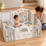 Toddler holding the car-shaped playpen door in a neutral Little Helper playroom