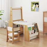 Children's wooden desk and chair set with books and art supplies in a room.