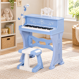 Blue children’s electronic piano with matching stool and microphone in a neutral playroom.