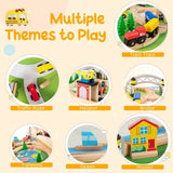 Natural wooden train table with a printed landscape, toy buildings, trees and traffic signs.