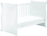 This 4-in-1 warm white Sleigh Cot Bed with Drawer is a beautiful Wooden Cot, Toddler Bed and day bed