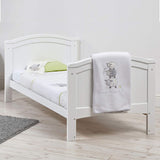 This eco-friendly 2-in-1 cotbed and junior bed converts easily from a cot to a toddler bed with two split end panels.