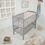 Warm grey Space saving grey wooden cot with slatted sides and mattress