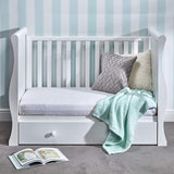 The side panels are easily removable, allowing you to either convert the bed into a daybed/sofa or a toddler bed.