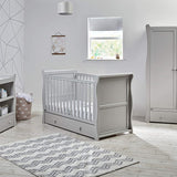 This cot includes a drawer at the bottom, supplying you with a place to store their toys, cuddlies or bedding.