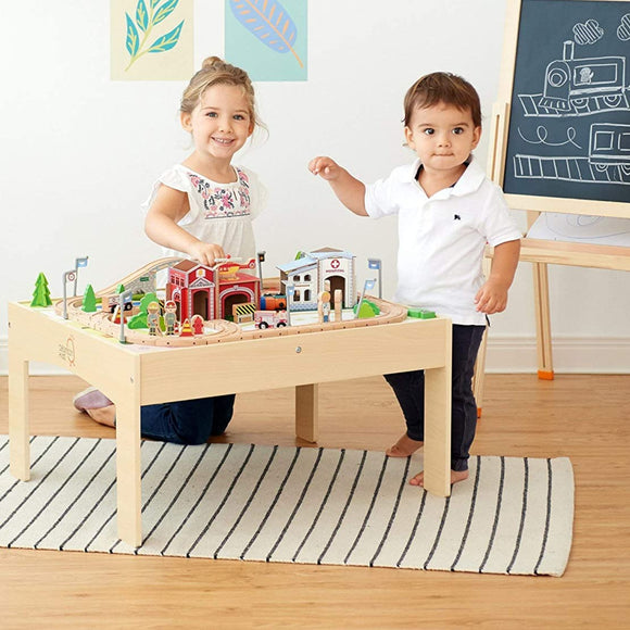 Numerous accessories on this montessori train table, from the fire station to the hospital, help kids grow their social skill