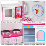 Esta cocina de juguete incluye un microondas, un reloj, una placa y un horno de juguete.