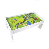 This train table has a board inset - city scene with road