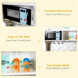 This toy kitchen has a pretend microwave, pegs for hanging utensils and a display shelf for cook's tools